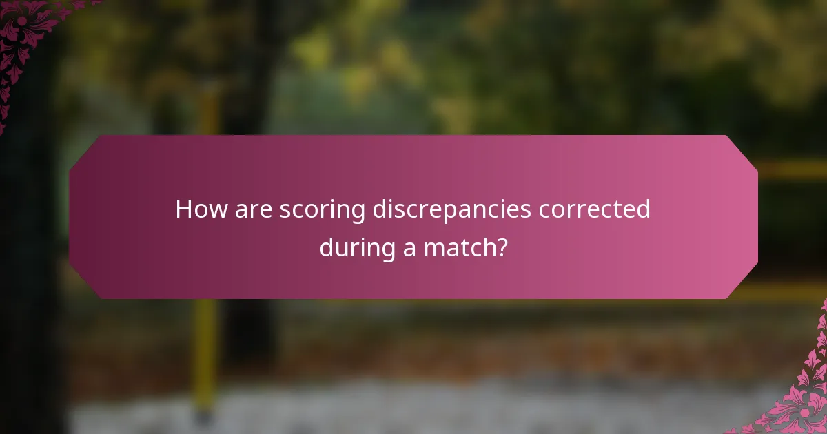 How are scoring discrepancies corrected during a match?